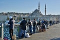 Anglers fishing from Galata Bridge in Istanbul, Turkey.